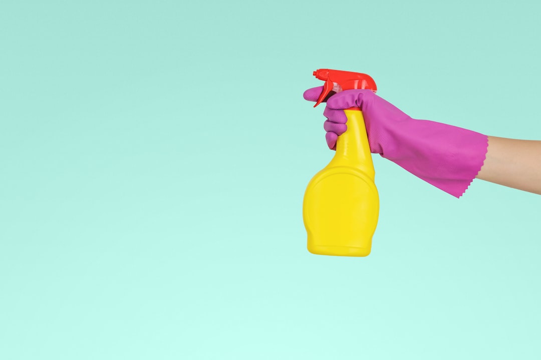 Services-03 person-holding-yellow-plastic-spray-bottle-zmnefoi3k